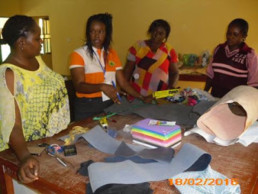 Olga teaching craft making to deaf teachers and students